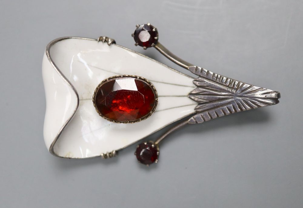 A Scandinavian? parcel gilt white metal, enamel and garnet set stylised leaf brooch, 56mm, gross 27.8 grams.